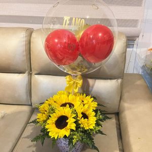 Cilindro con girasoles y globo burbuja